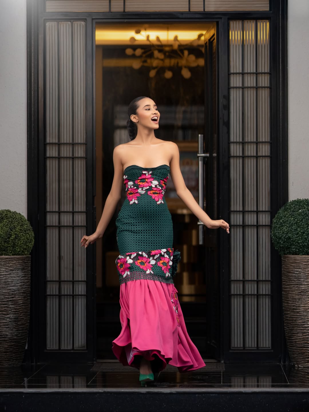 Model wearing the Emerald Reverie look in a full-length editorial portrait